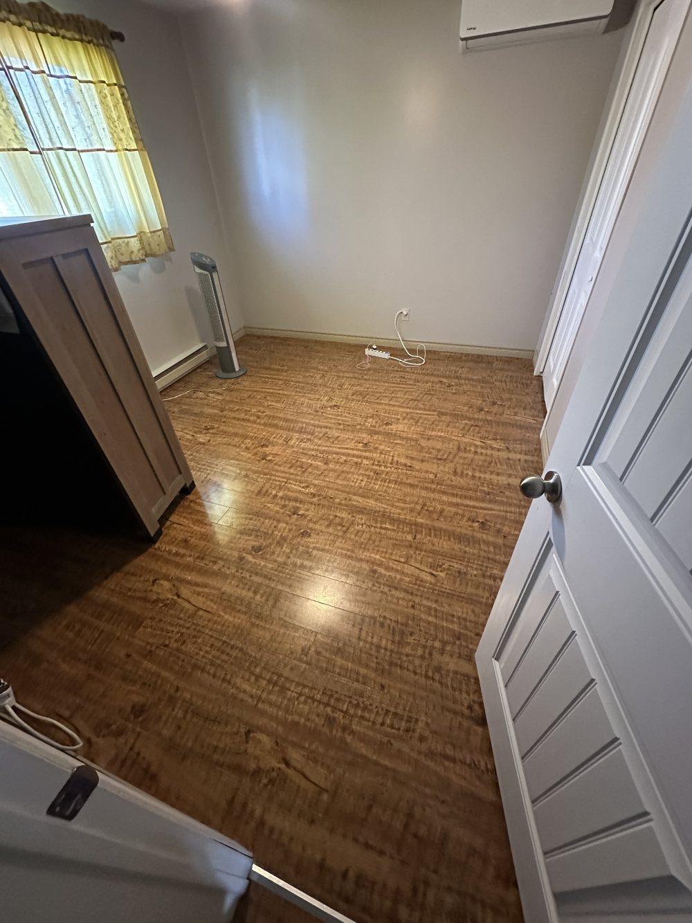 Bedroom with a worn old floor before flooring