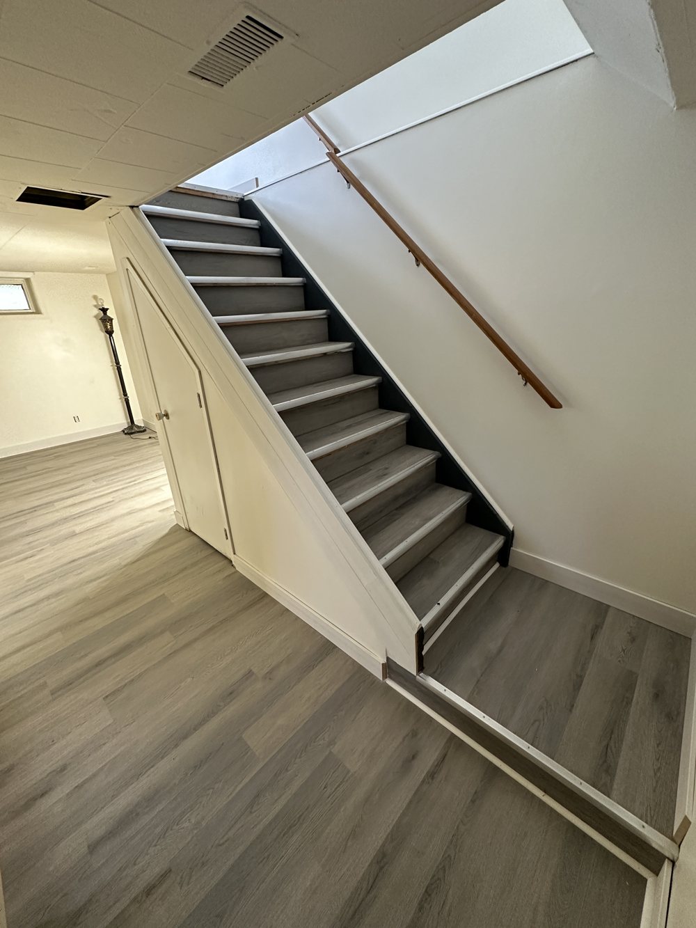 Stairs and landing finished with vinyl plank flooring