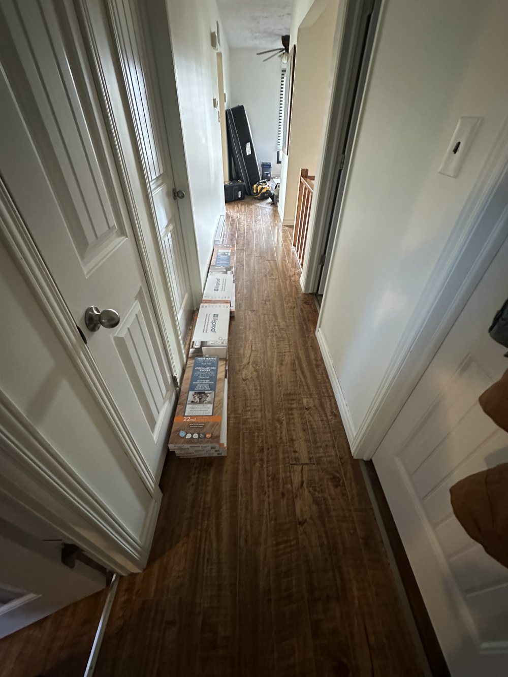 Hallway with an old damaged floor before flooring