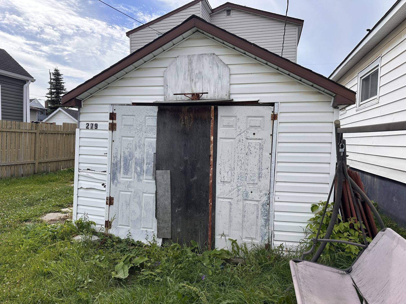 Old garage doors before replacement