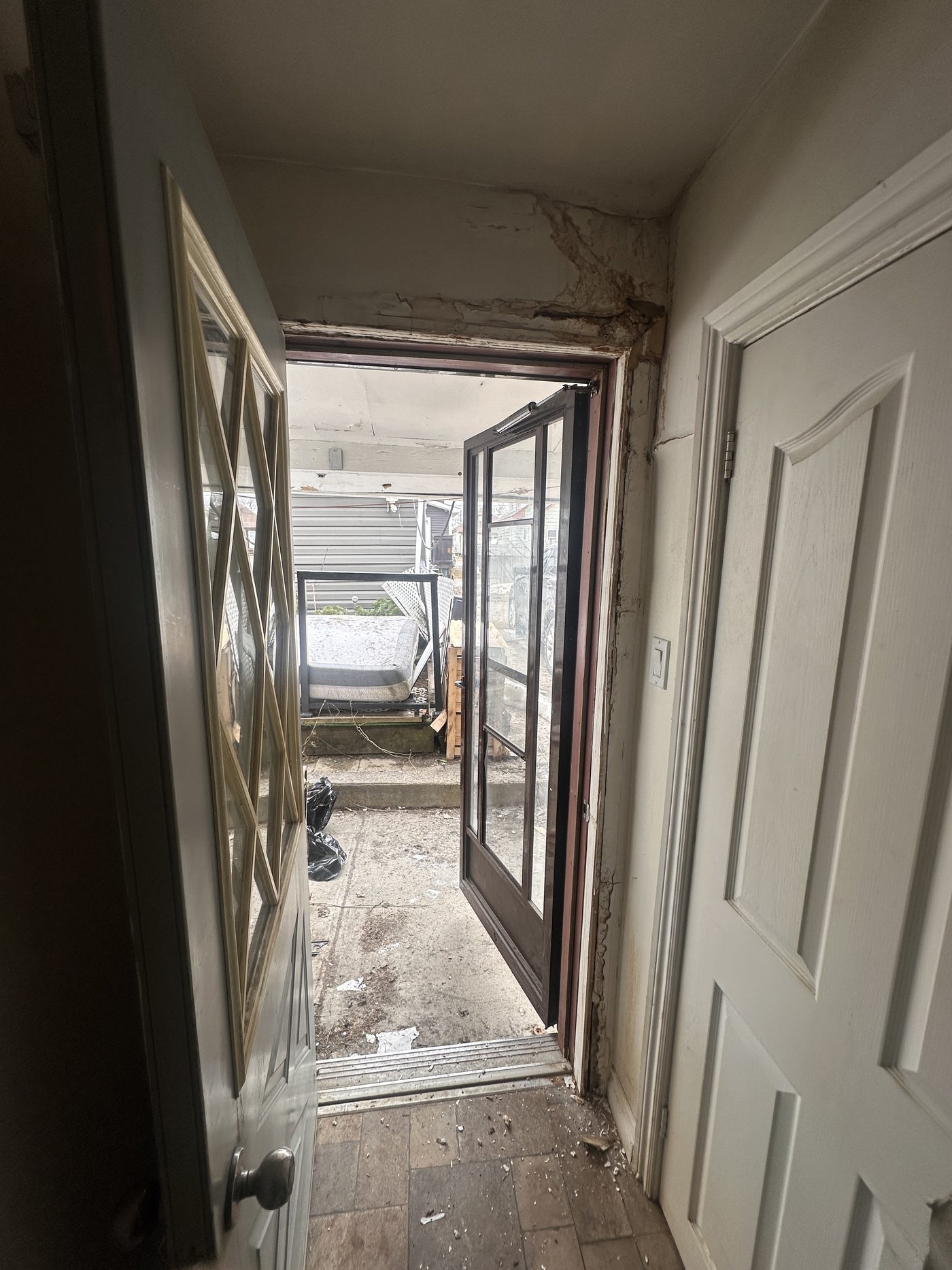 Water damage around door before repair
